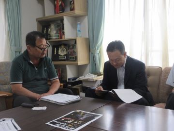 説明する松永代表