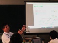 説明をする添野参事官